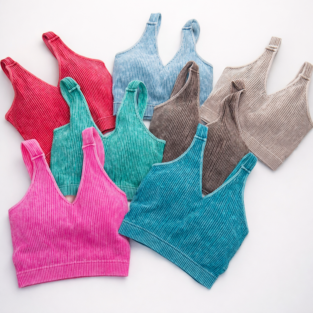 Ribbed seamless V-neck sports bras in multiple colors including pink, red, teal, blue, brown, and beige displayed on a white background