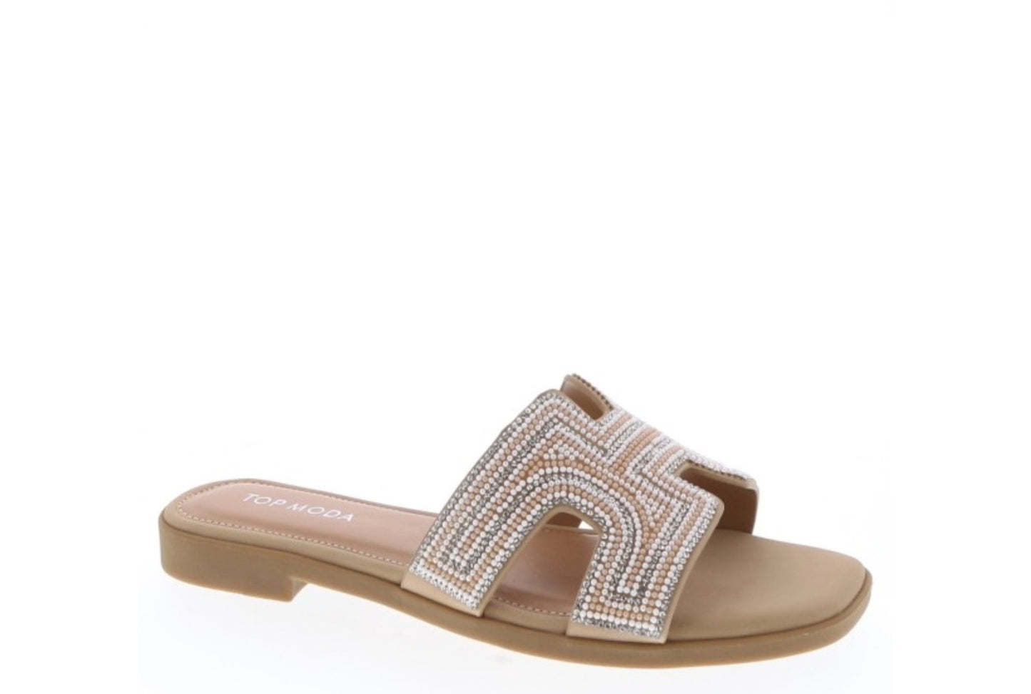 Beige sandal with a decorative strap on a white background